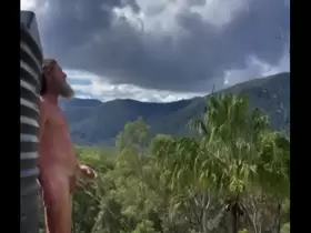 Naked Christian pissing outdoors on the ridge with mountain views. Peepee piss from Australian